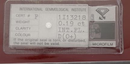 A diamond on paper (sealed) accompanied by its IGI