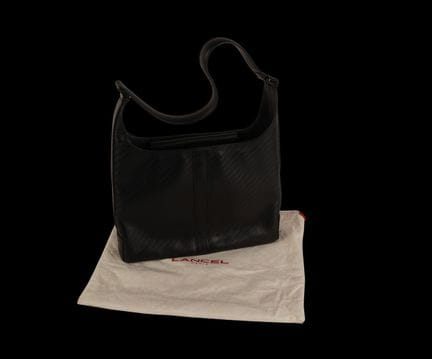 LANCEL
Set di due borse in pelle goffrata. 
Una de