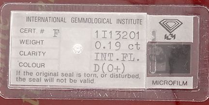 A diamond on paper (sealed) accompanied by its IGI