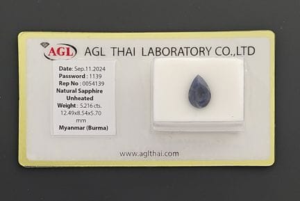 A 5.21-carat sapphire on paper.
Accompanied by its