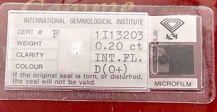 A diamond on paper (sealed) accompanied by its IGI