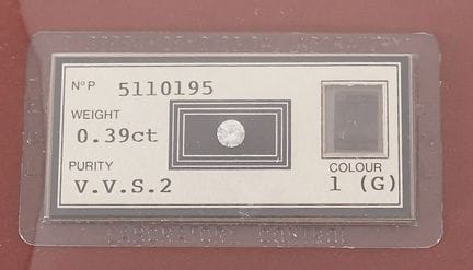 A diamond on paper (sealed) accompanied by its IGI