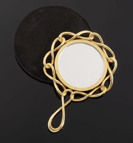 VAN CLEEF  ARPELS 
Round metal hand mirror with a 