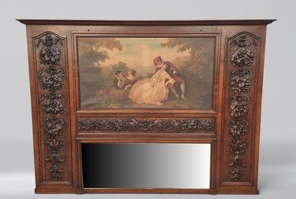 A wooden trumeau carved with a frieze of foliage a