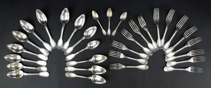 Silver flatware set in a mixed-pattern design, con