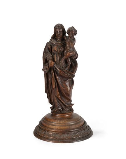 SCULPTED WALNUT MADONNA AND CHILD
resting on a cir