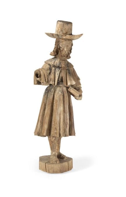 CARVED WOODEN FIGURE
depicting Saint James, with t