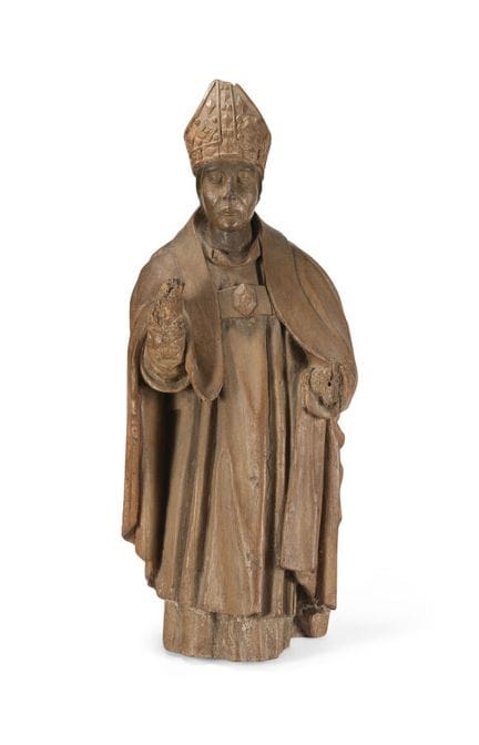 CARVED WOODEN FIGURE 
depicting a bishop.
Late 16t