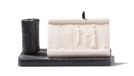 CYLINDER SEAL 
engraved with three figures. 
Hemat