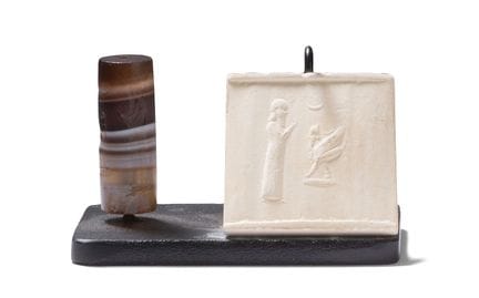 CYLINDER SEAL 
engraved with a dignitary facing a 
