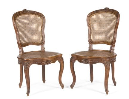 PAIR OF CANED CHAIRS IN MOLDED AND CARVED WALNUT
w