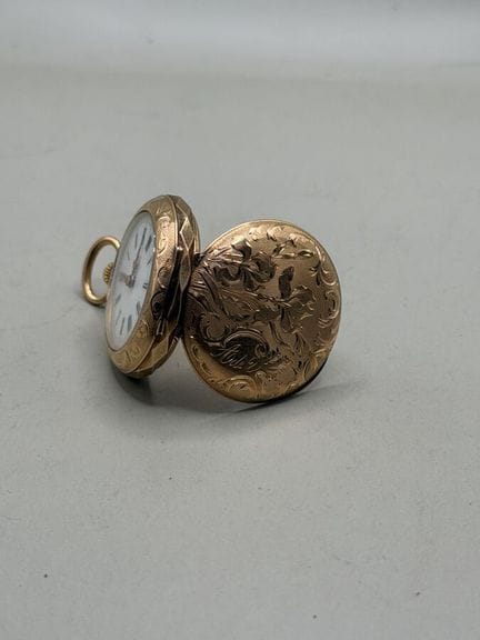 Beschädigte Taschenuhr aus 750er Gelbgold, Rücksei