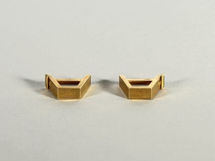 Par de botones de manga trapezoidales de oro amari