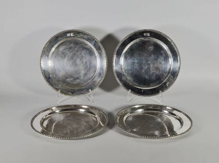 Set of four silver plates (925°/°°), with a wing e