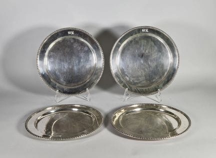 Set of four silver plates (925°/°°), with a wing e