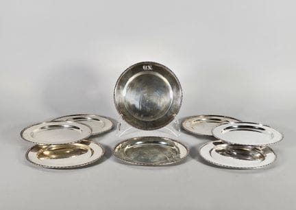 Set of eight small silver plates (925°/°°) with th