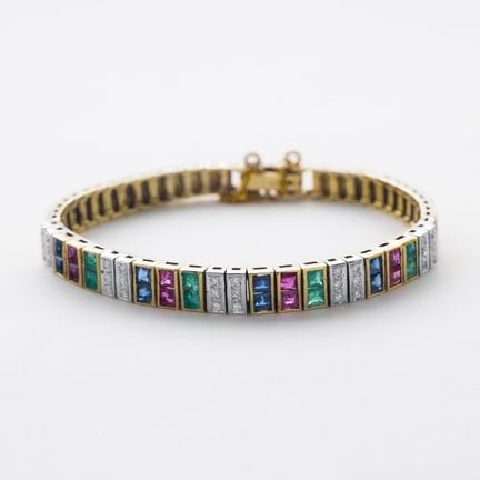 Pulsera articulada en oro bicolor 14K con bandas c