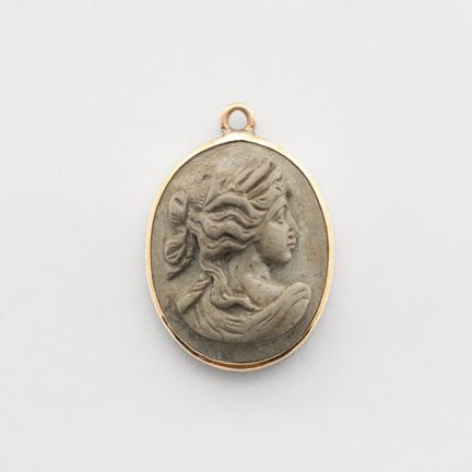 Gold pendant with a volcanic stone cameo depicting