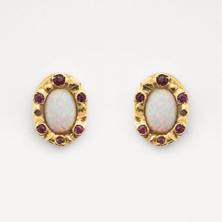 Earrings featuring a 7 x 5 mm oval opal cabochon f