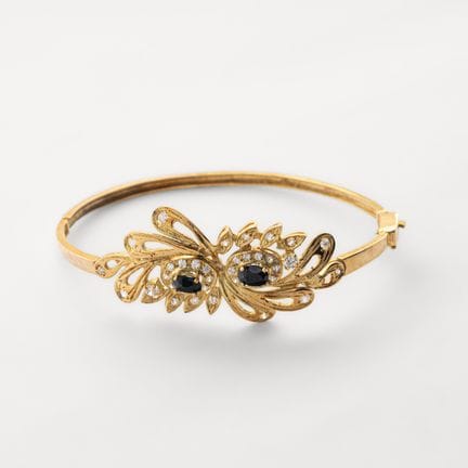 Pulsera esclava en oro con centro de hojas caladas