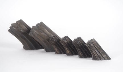 A set of six Art Deco-style sculptures in patinate