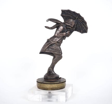 PAX. 
Bronze radiator cap decorated with a woman t