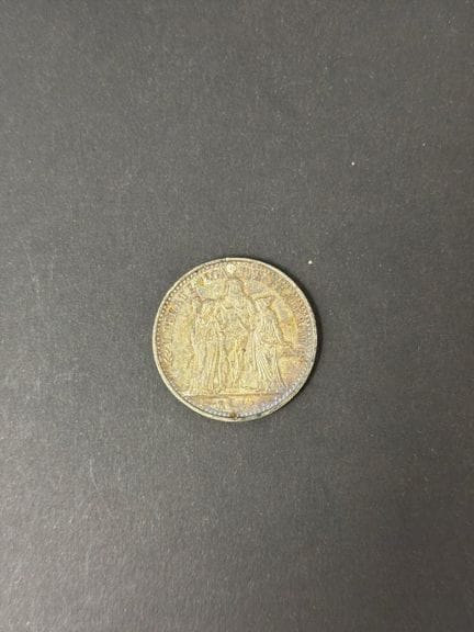 Una (1) moneta da 10 FF in argento “Ercole”, 1965
