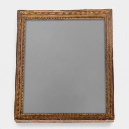 Miroir rectangulaire en bois sculpté à décor de ra