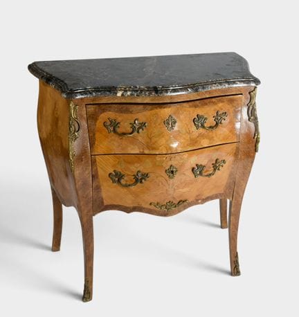 Small, curved chest of drawers made of rosewood an