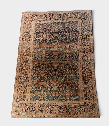 IRAN
Hand-knotted wool rug with a stylized floral 