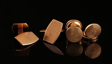 Two pairs of cufflinks, including one pair in gold