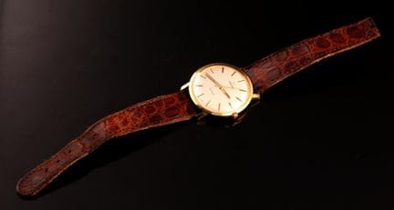 Men's wristwatch with a yellow metal case, Omega m