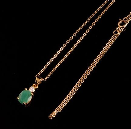 Necklace consisting of a gold-plated curb chain ho