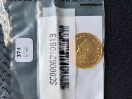 1 1-ounce Krugerrand gold coin 
Made of gold (900‰