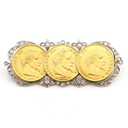 Broche  En or jaune 18 K (750‰) et platine, retena