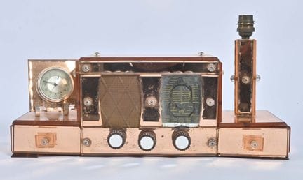 米歇尔公司，
50年代产，外覆粉红色冰晶板、兼具台灯功能的收音机闹钟。有使用痕迹。

重要信息：

