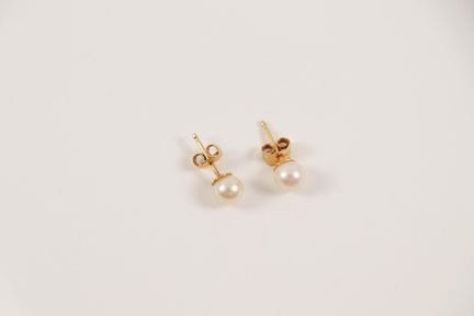Pair of 18K yellow gold (750) stud earrings set wi