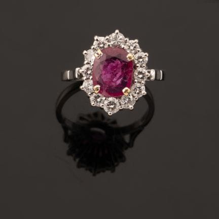 Ruby and Diamond Ring
Set with an oval-shaped ruby