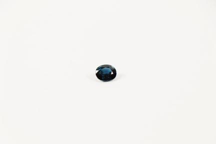 Oval sapphire on paper, weighing approximately 1.6