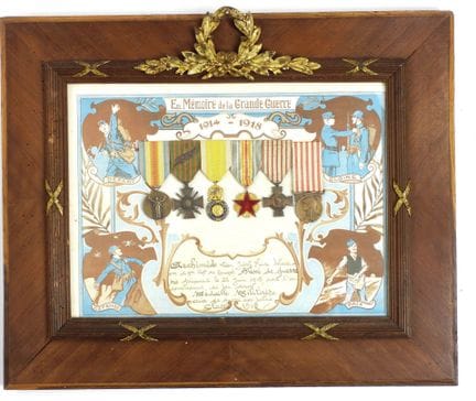 DECORATIONS. Glass-covered frame containing 6 deco