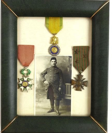 DECORATIONS. Glass-topped frame containing 3 decor