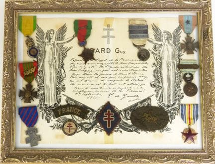 MEMORABILIA. Frame containing 8 decorations, inclu