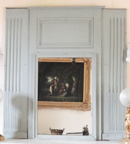 Molded, carved, and gray-lacquered wooden fireplac