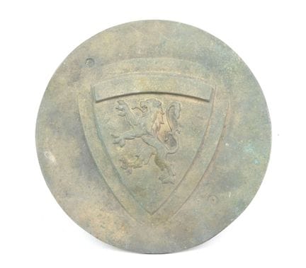 Circular bronze plaque decorated with a Franche-Co