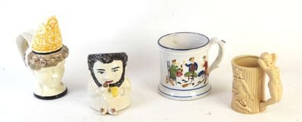 CURIEUSE CHOPE en faïence polychrome à décor de pe
