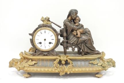 Bronze CLOCK depicting the Virgin on a chair, with