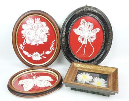 Four oval and rectangular frames decorated with bu