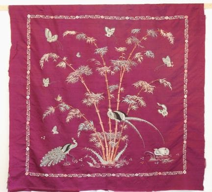 Burgundy wall hanging on unframed canvas featuring