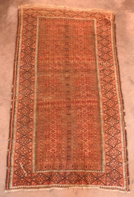 Three hand-knotted Persian rugs in brick tones
182