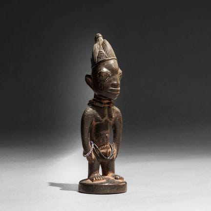 Yoruba, Nigeria - Ibedji figure. Wood with dark br